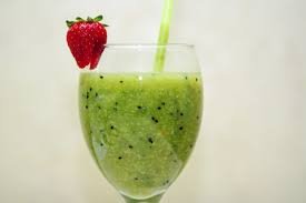 Making of homemade green protein smoothie which is a combination of spinach, chia seeds and milk for weight loss