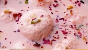 Rasmalai served with a rose petal syrup